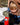 Reflective sticker of a cute racoon on a skateboard shown on a child's thermos