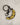 Enamel and metal keychain in the shape of a bruised banana featuring the phrase "been better"