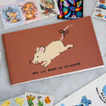 Small sticker album with a cute mouse and "my lil book of stickers" printed on the cover