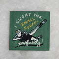 Patch with woven image of a frog in workout gear and the phrase "I sweat the small stuff - profusely!"