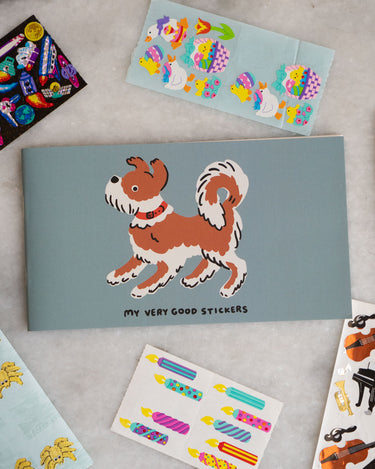 Sticker album with a dog and "my very good stickers" printed on the cover