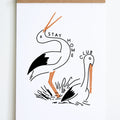 standing bird with sitting bird outlined in black with orange beaks and legs with stay home club text around them 