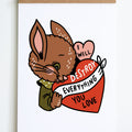 brown bunny with green shirt holding a pink and red heart with text that reads i will destroy everything you love inside hearts